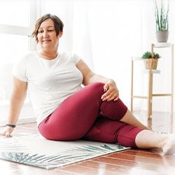 Picture of a woman stretching at home