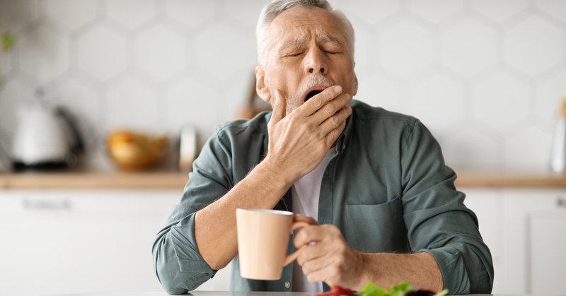 Photo of man yawning