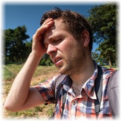 Photo of a man experiencing heat stroke while on a hike