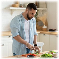 Photo of a man preparing a meal in a kitchen