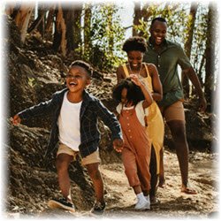 Photo of a family taking a walk in the woods