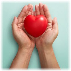 Photo of a heart-shaped toy held in a person's hands