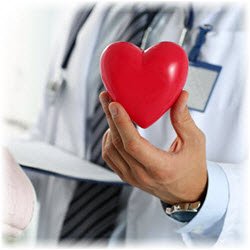 Photo of a doctor holding a heart-figure in his hand