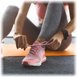 Photo of woman tying exercise shoe