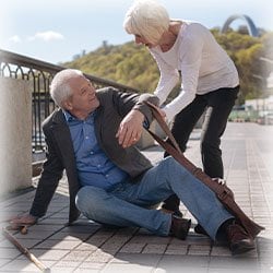 Photo of woman helping man who fell 