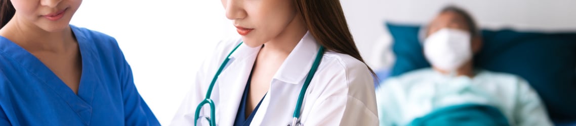 Photo of Doctor and Nurse with a patient