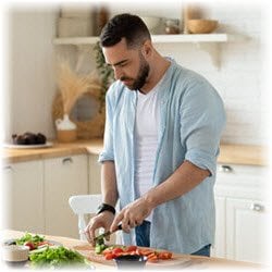 Photo of a man preparing a meal in a kitchen