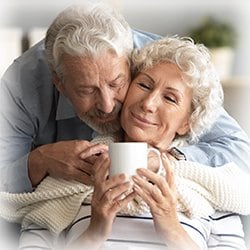 Picture of elderly couple embracing