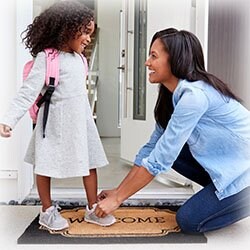 Mom getting child ready for school