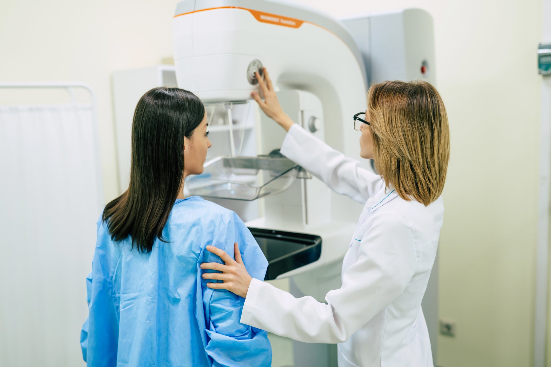 Photo of woman getting screened for breast cancer