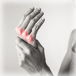 Photo of hand experiencing joint pain