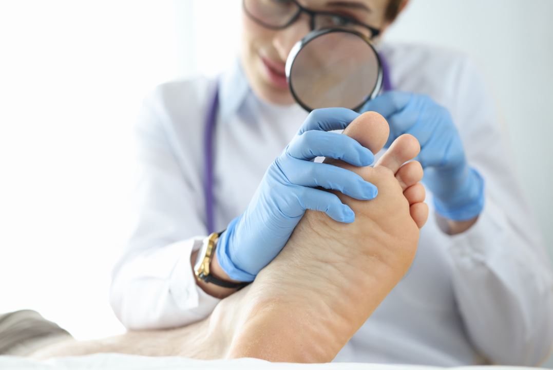 photo of a doctor inspecting a patients foot