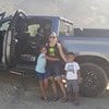 Photo of the Cervantes family posing next to a pickup truck